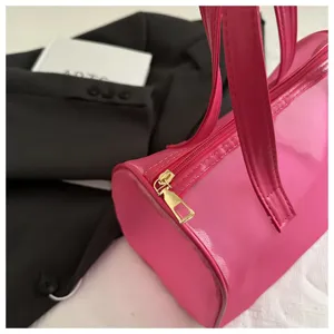 Pink translucent PVC cylinder handbag, portable large capacity shoulder jelly bag for daily use.