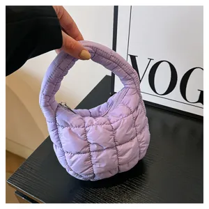 Purple quilted puffer mini handbag, stylish cloud tote bag with zipper closure for women.