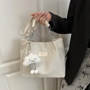 Casual canvas tote bag for women, chic shoulder bag with chain strap and cute cloud charm.