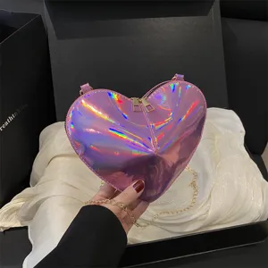 Chic holographic heart-shaped crossbody bag with gold chain, trendy PU leather mini shoulder bag.
