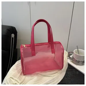 Pink translucent PVC tote bag detail view, showing mesh texture and portable handle design.