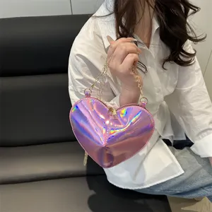 Stylish holographic heart-shaped shoulder bag for women, trendy glossy patent leather mini handbag.