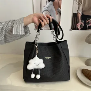 Black canvas tote bag with chain strap and cute cloud charm for women daily commuting school.