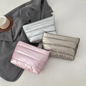 Shiny quilted puffer clutch bag stylish cosmetic organizer minimalist padded purse for women.