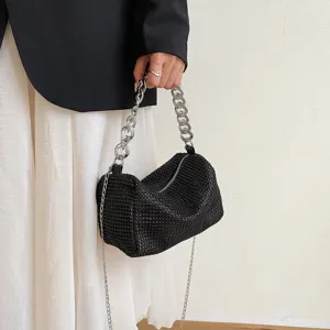 Chic black rhinestone hobo bag detail featuring sparkling crystals and a chunky silver chain.