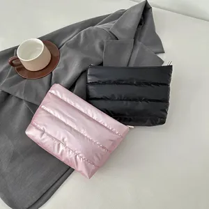 Puffer quilted clutch pouch in pink and black colors, stylish minimalist design for daily use.