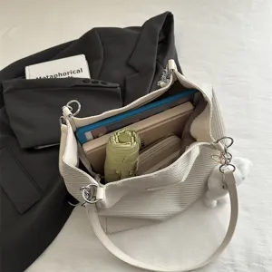 Minimalist casual woven shoulder bag with large capacity, perfect for daily commute and study.