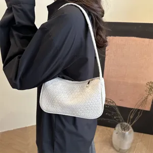 Stylish white woven shoulder bag for women, classic hobo armpit design, casual daily handbag.