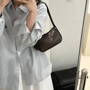 Women woven shoulder bag brown underarm handbag stylish striped shirt outfit OOTD fashion casual
