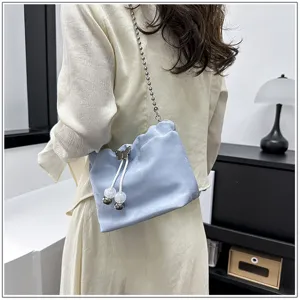 Fashion light blue cloud shoulder bag with chain strap and cute butterfly drawstring details.