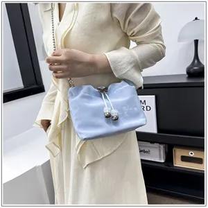 Light blue velvet shoulder bag for women featuring metal chain and cute butterfly drawstring.