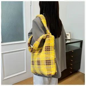 Detailed view of fluffy plaid shoulder tote bag, soft fuzzy texture for casual autumn and winter.