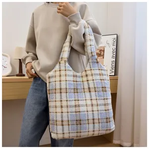 Cozy plush plaid tote bag for women, soft fuzzy shoulder bag for daily commuting and casual style.