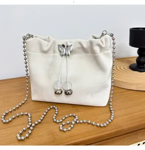 White velvet chain bucket bag for women, stylish shoulder crossbody bag with bead strap.