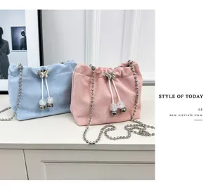 Velvet bucket bag with metallic chain strap and butterfly drawstring for women stylish.