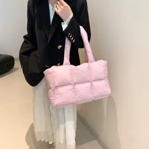 Stylish pink quilted puffer tote bag for women, soft down cotton oversized shoulder handbag.