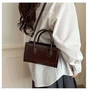 Vintage brown top-handle crossbody bag for women, chic daily casual shoulder bag detail.