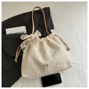 Chic straw shoulder bag with floral lace ribbon, PU handle, elegant fashion tote for women.