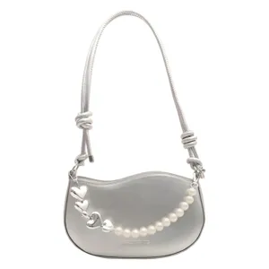 Silver asymmetrical handbag with pearl and heart charms, trendy niche design shoulder bag.