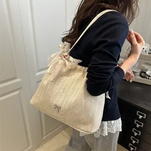 Stylish straw tote bag for women with elegant lace bow detail, large capacity shoulder bag.