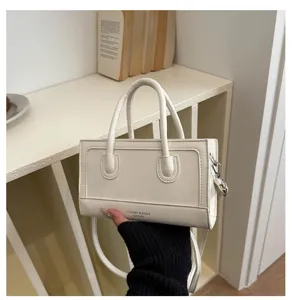 White minimalist retro handbag detail, structured PU leather top handle crossbody bag for women.