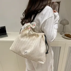 Women's straw woven shoulder tote bag with lace bow, large capacity summer casual handbag.