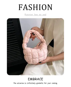 Close-up view of the pink quilted puffer cloud bag showing soft design details clearly.