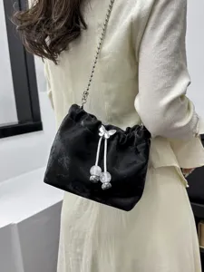 Black velvet bucket bag with chain strap chic crossbody shoulder bag for women daily fashion.