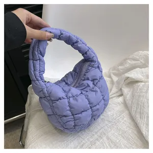 Light purple quilted puffer cloud bag, stylish mini handbag with soft padded design for women.