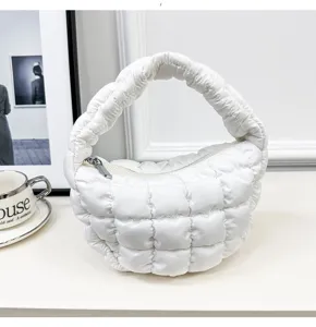 White quilted puffer cloud bag detail view, soft fabric mini top-handle handbag showcase.