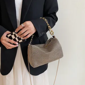 Elegant sparkling rhinestone evening handbag with chunky gold chain handle and strap.