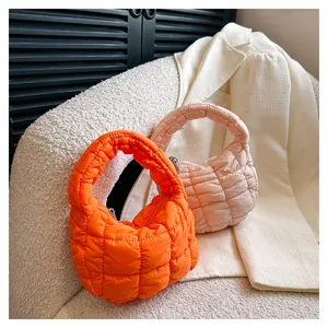 Close-up detail of the stylish quilted puffer cloud handbag, featuring soft texture.