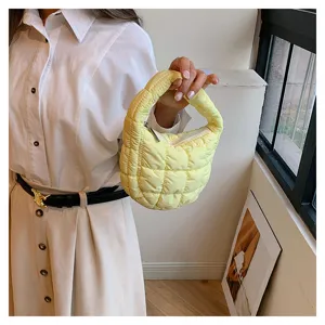Trendy yellow quilted cloud puffer mini handbag, stylish puffer design for women daily wear.