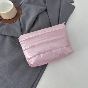 Pink quilted clutch bag for women, soft puffer cosmetic pouch, minimalist daily handbag.