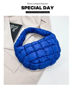 Detailed view of the trendy royal blue quilted cloud bag, showcasing soft down padding.