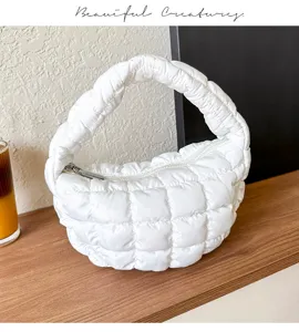White quilted cloud handbag for women, soft puffer tote bag with zipper and chic pleated handle.
