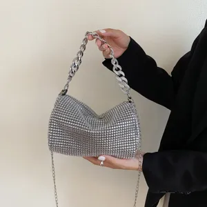 Shiny rhinestone chain handbag detail, elegant evening crossbody bag with thick handle.