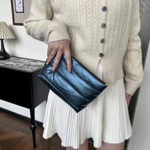 Minimalist quilted puffer clutch bag, soft padded handbag for women, casual daily travel.