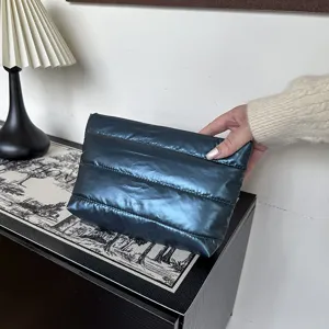 Metallic blue quilted clutch bag for women, stylish large capacity daily padded design.