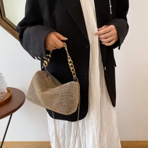 Elegant rhinestone evening bag with chunky gold chain handle and stylish design for women.