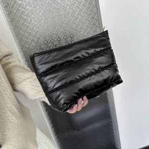 Black quilted puffer clutch bag, soft padded cloud pouch, minimalist daily purse.