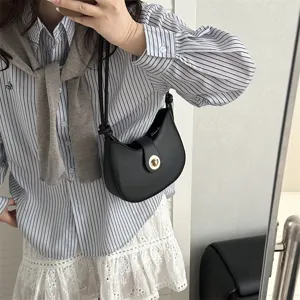 Minimalist black hobo shoulder bag for women, stylish Korean style casual dumpling purse.