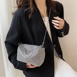 Detailed view of a silver rhinestone chain evening bag, stylish sparkly crossbody purse.