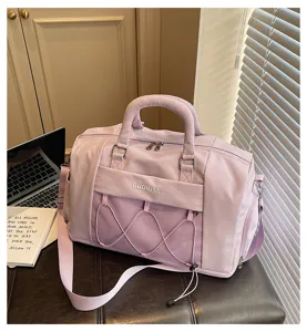 Large capacity travel duffel bag with shoulder strap and mesh front pocket for gym and sports.