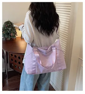 Large capacity travel shoulder bag for women, lightweight purple star tote bag for daily commute.