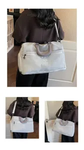 Large capacity travel duffel bag for women light gym weekender bag with shoulder strap detail.