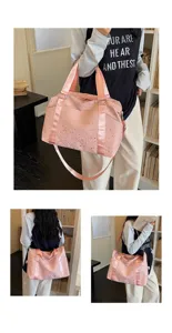Pink travel duffel bag detail, star print shoulder strap design, casual commuting style.