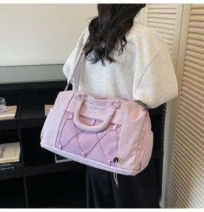 Large capacity travel duffel bag with mesh pocket and shoe compartment for gym and weekend trips.
