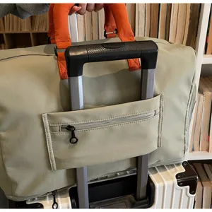 Travel duffel bag for women lightweight large capacity overnight weekend gym carry on.