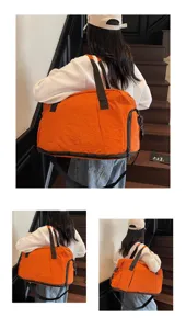 Large capacity travel duffel bag for sports, fitness, and weekend getaways with durable straps.
